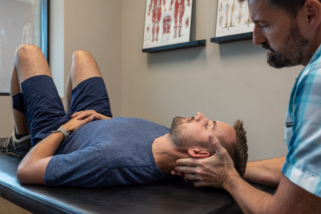 assessing neck range of motion and pain